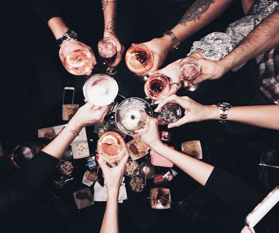 Glasses cheers together aerial view. 