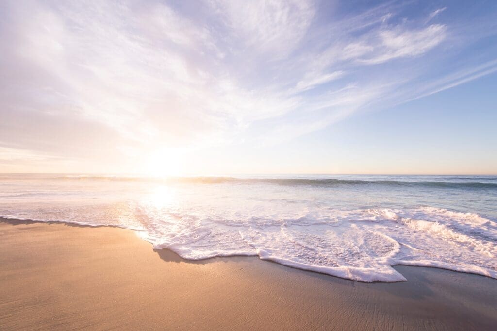 Water washing over sand at beach