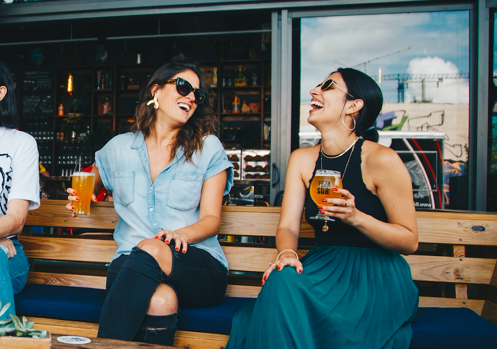 Two friends laughing together. Photo by ELEVATE from Pexels.com
