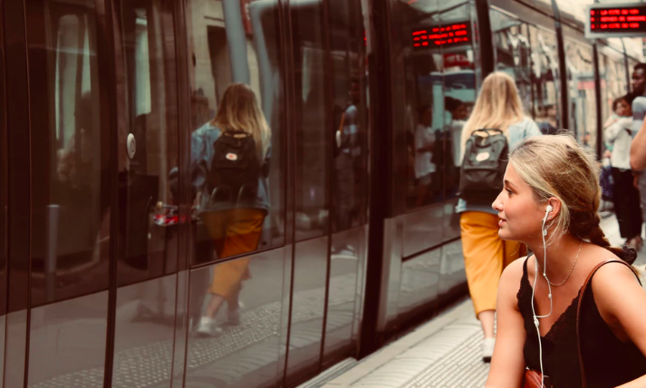 Image of girl listening from earphones. Image by Rich Smith from unsplash.com