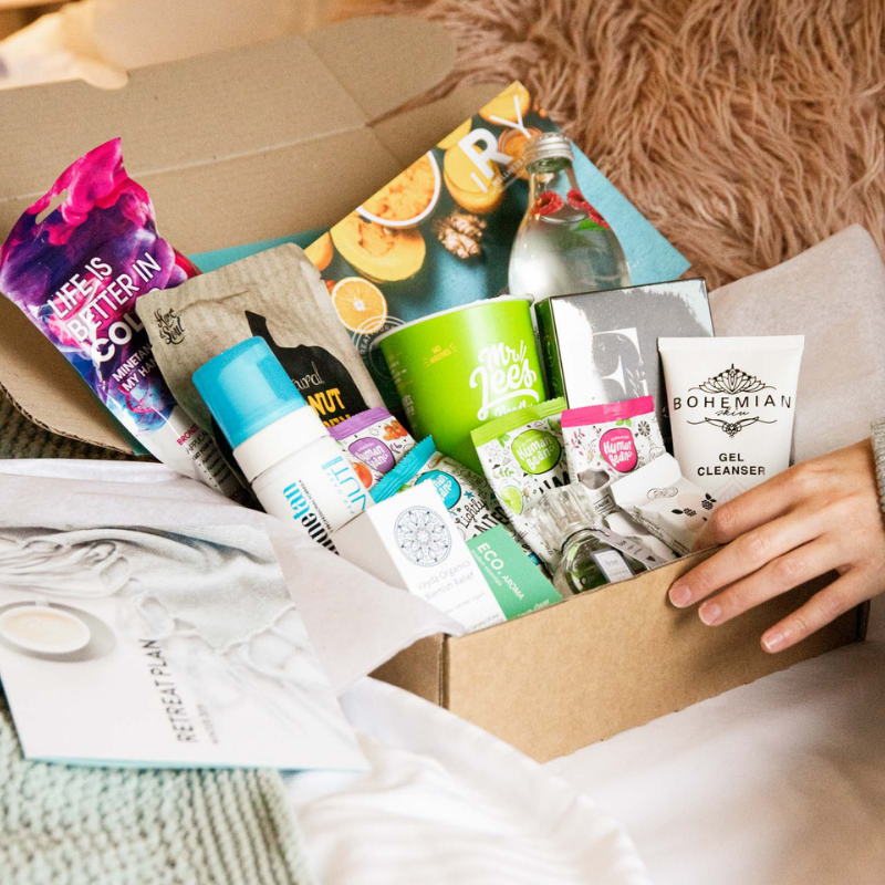 Open cardboard box with skincare products. 