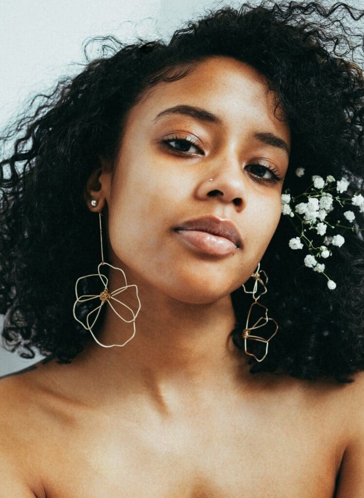 Girl with mismatched earrings. 