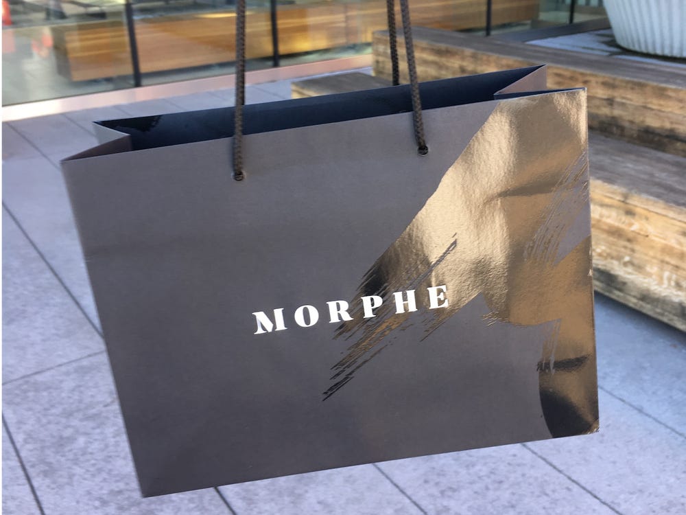 Black paper bag with MORPHE written on it