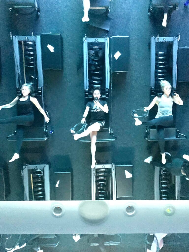 three women on their backs doing pilates