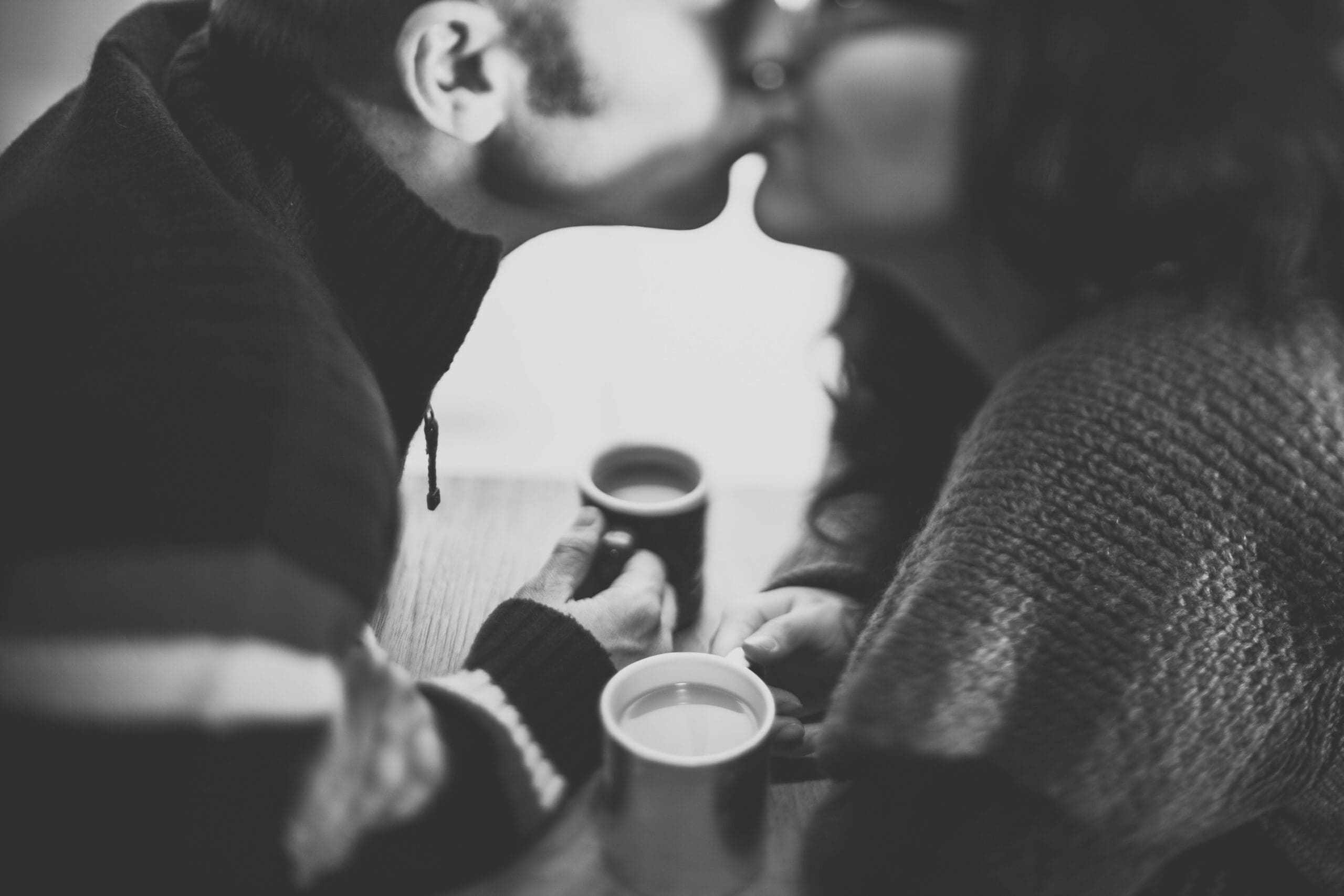 Couple kissing in black and white