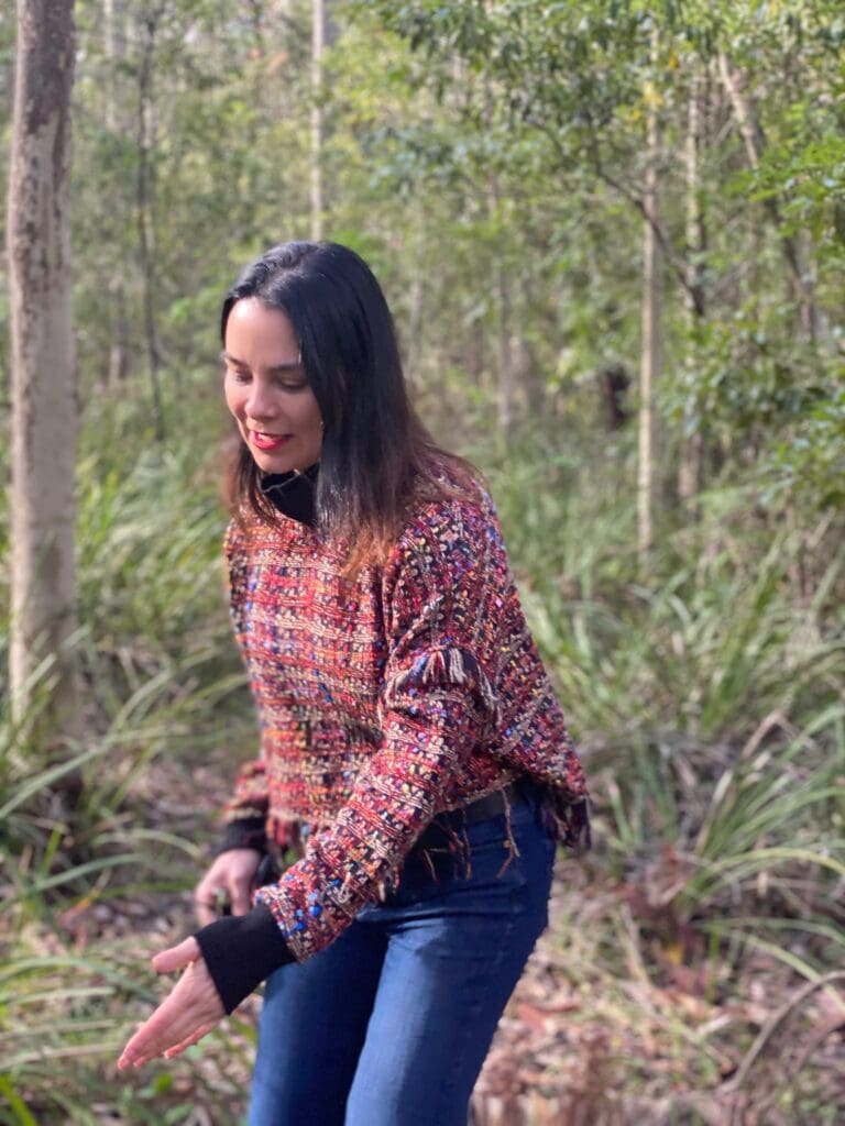 woman in red top and blue jeans in the Australian Outback.