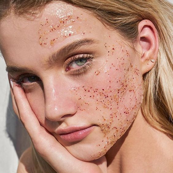 Girl with exfoliator on face