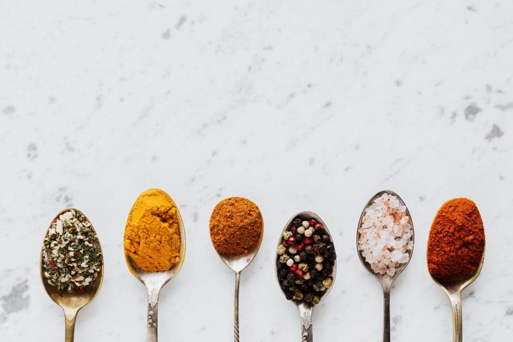 spices on spoons for seasoning food