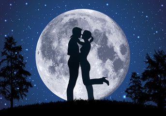 couple in front of the moon