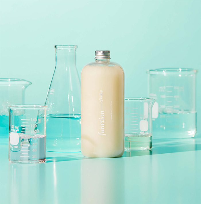 Shampoo surrounded by science beakers