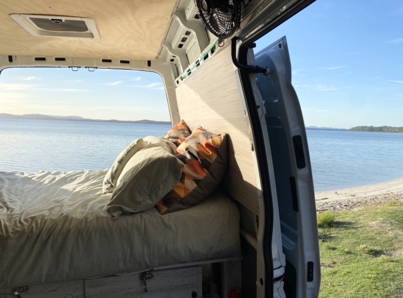 Campervan trip: Van parked at beach overlooking beautiful view