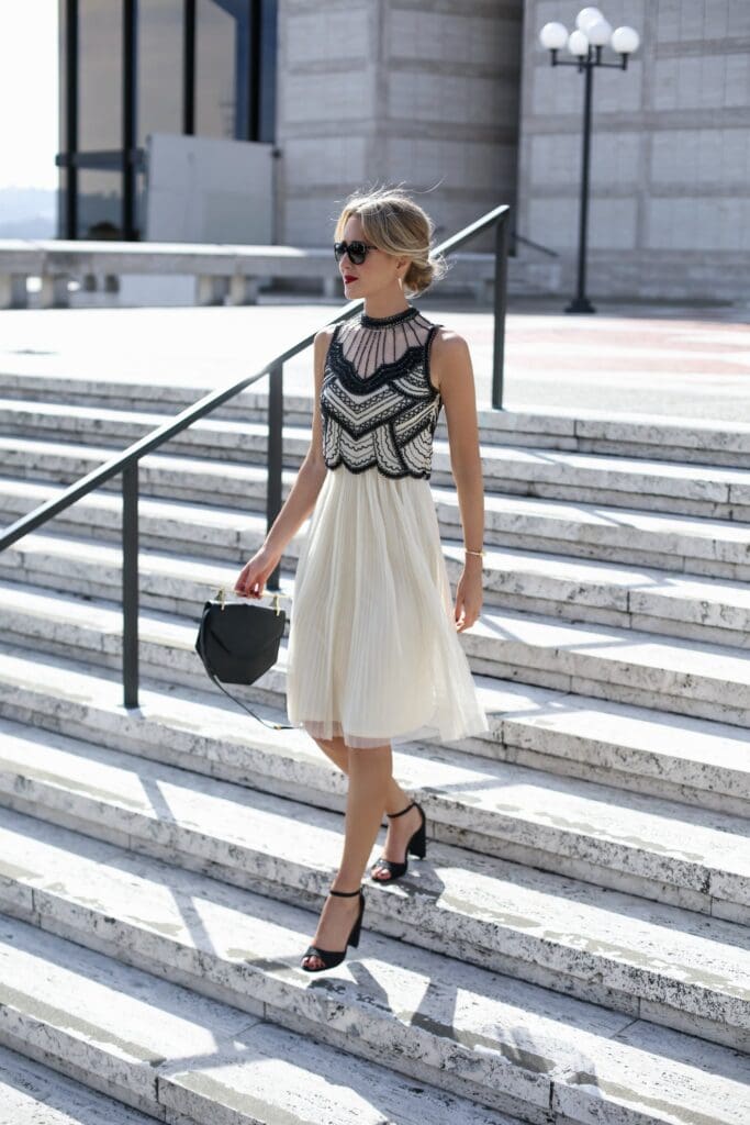 woman dressed up for her first job walking down stairs
