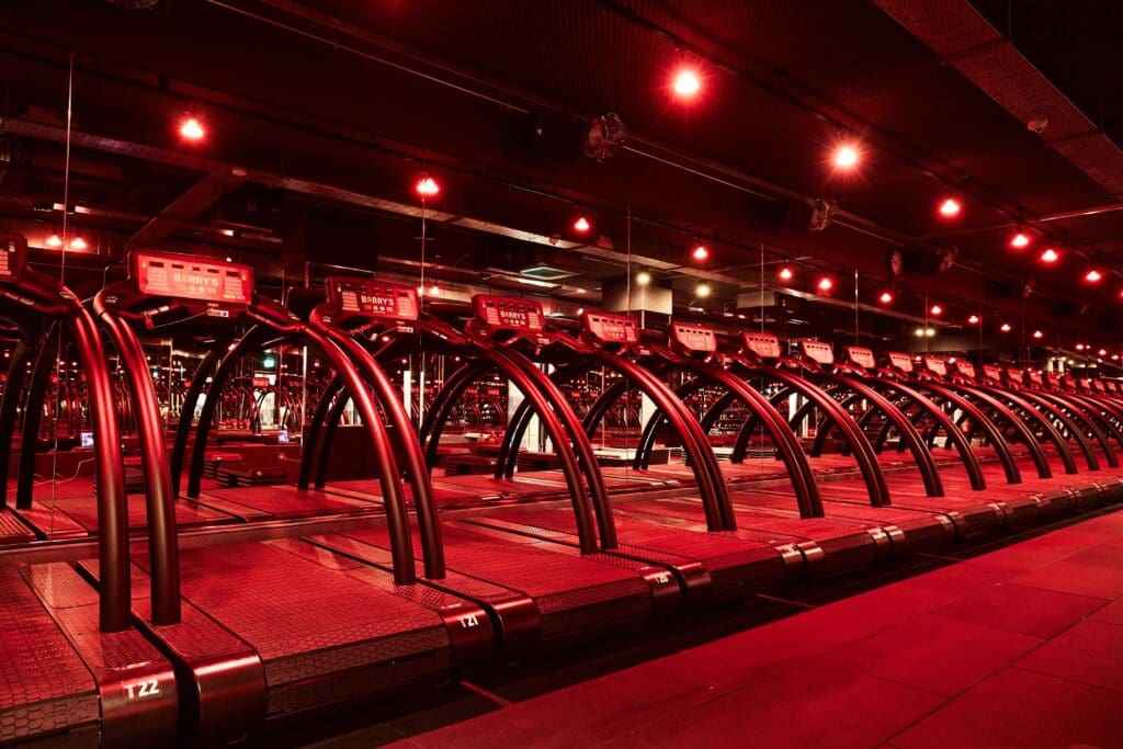 Barry's bootcamp red room with treadmills, located in Surry Hills and Martin Place.