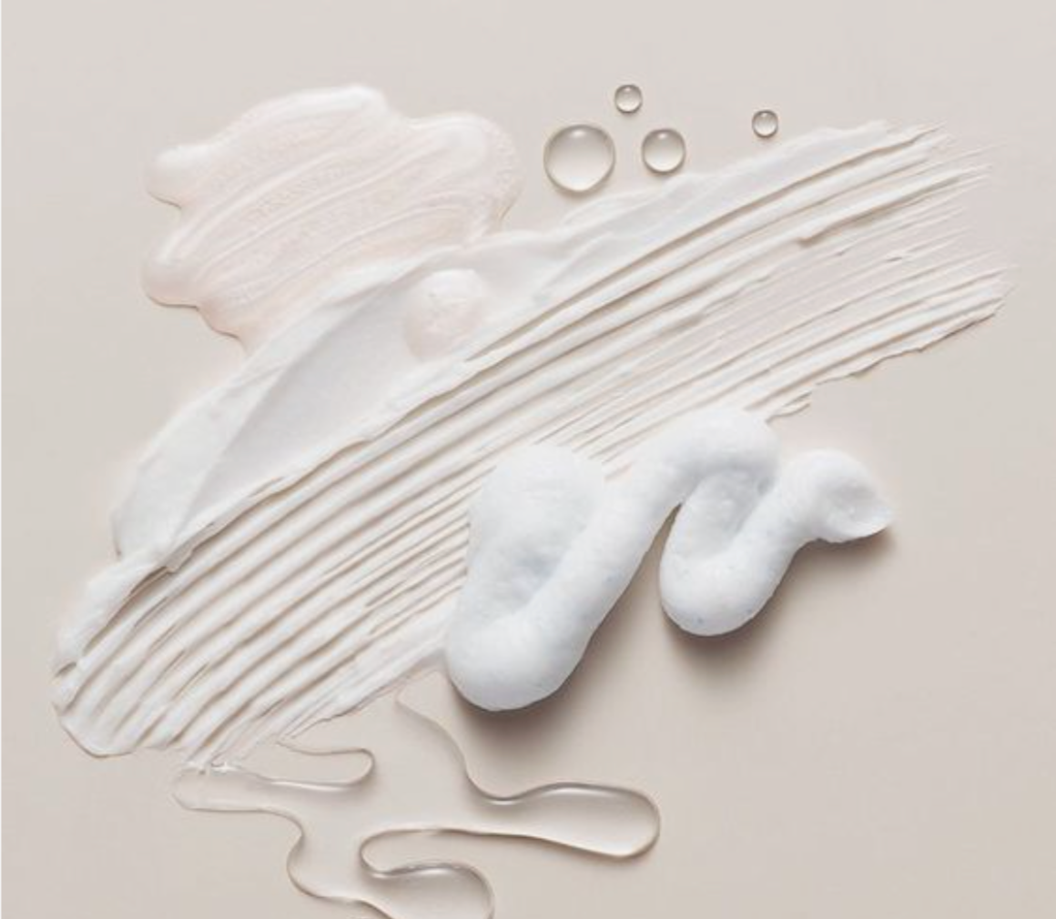 Array of creams, foams and gels on a surface