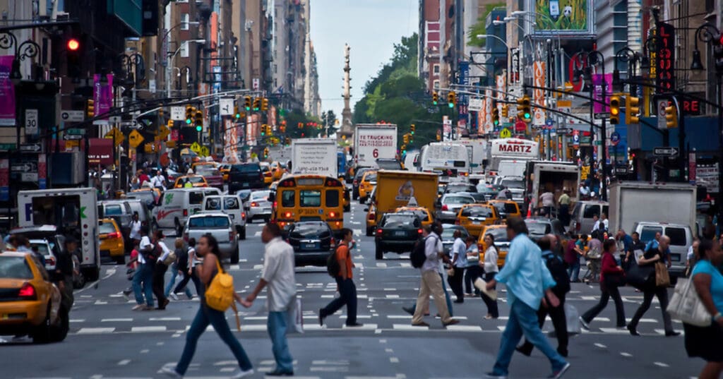 Busy street filled with people and cars
