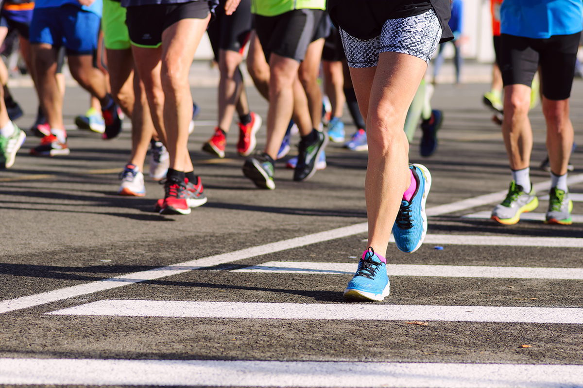 Marathon runners running in large group